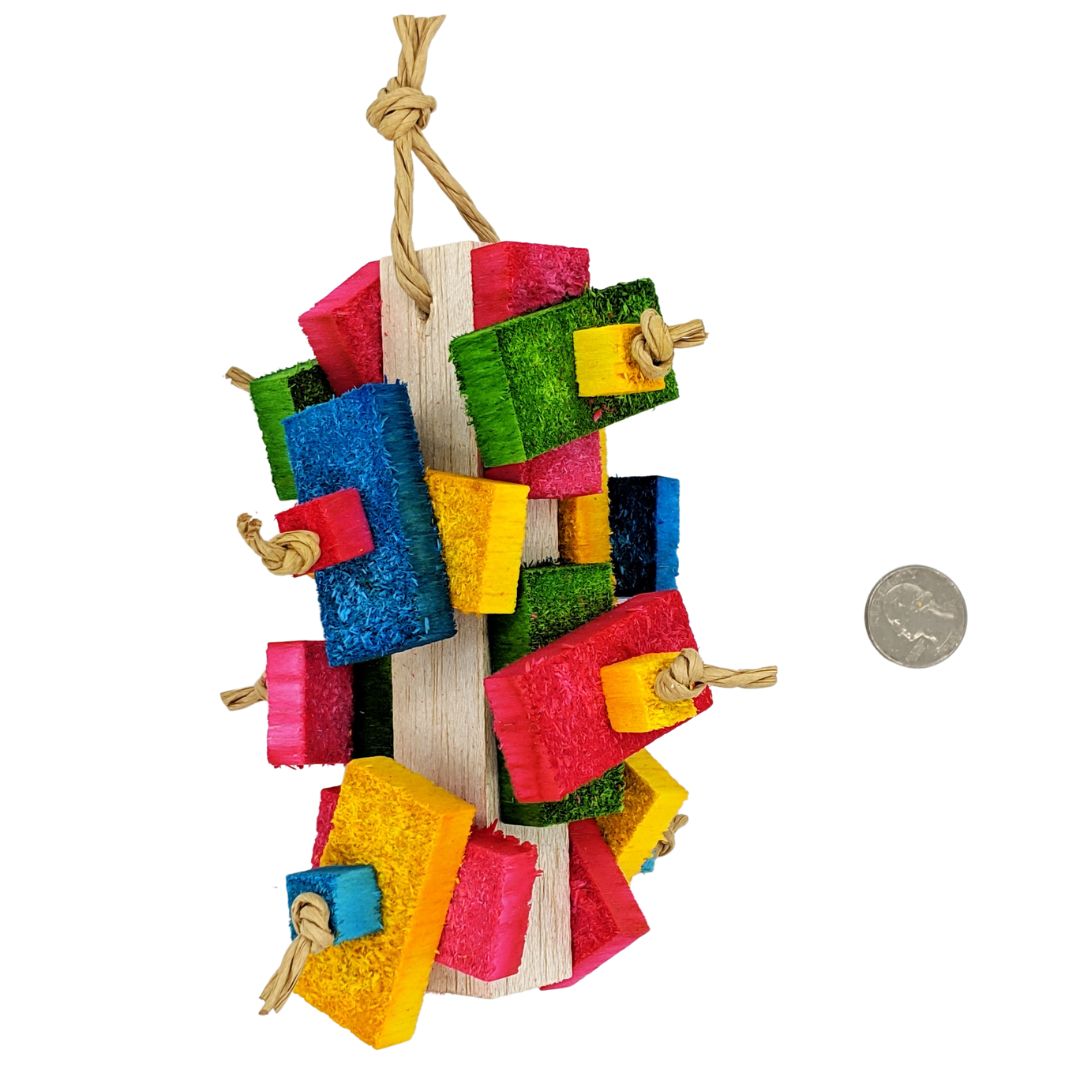 A balsa parrot toy. On a 1 inch by 6 inch base, has 16 half inch balsa slats and 8 half inch balsa cubes attached, 2 sets per side. strung with paper rope. Shown with quarter for scale