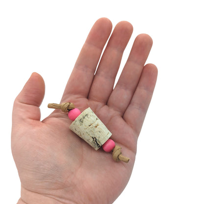 Popper Foot Toy by Lil Monsters Bird Toys. Held in hand for scale. 