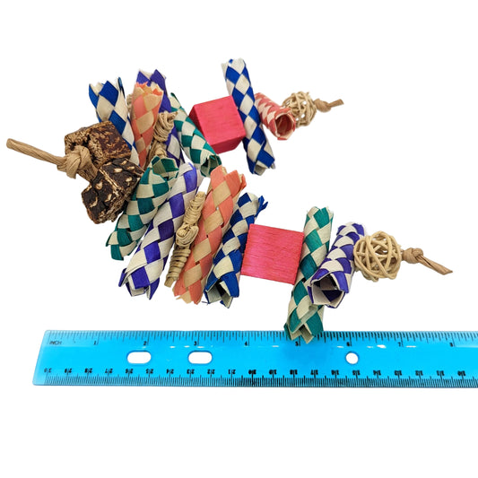 Remi by Lil Monsters Bird Toys, next to ruler for scale