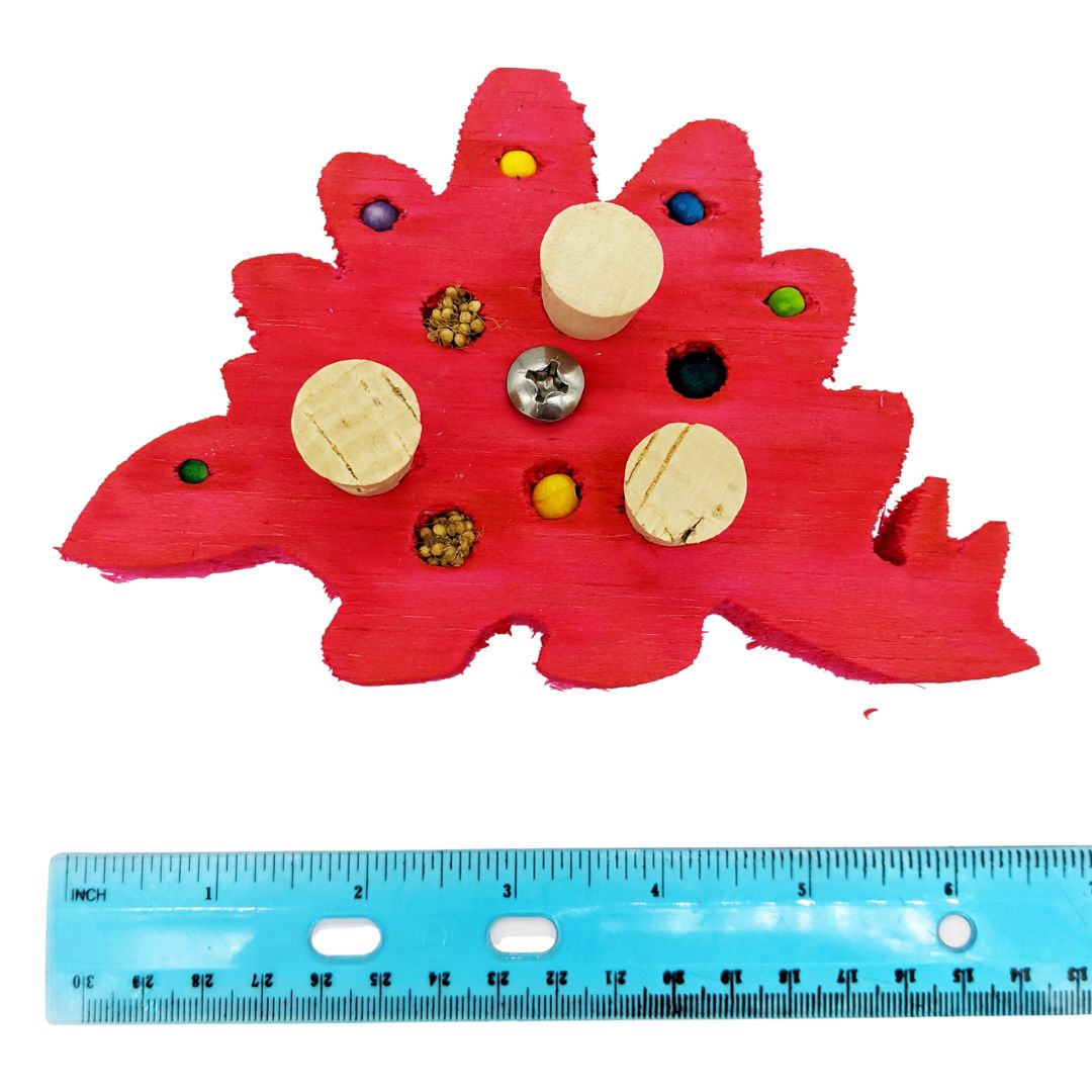Stegosaurus shaped piece of balsa. One 4mm bead eye, 4x 6mm beads in back, 3 pieces of cork, and 4 holes with a mix of millet and 8mm beads. Shown at 6 inches next to ruler