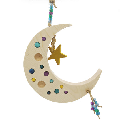 Sweet Dreams by Lil Monsters Bird Toys. A Crescent Moon Shaped Bird toy or swing, made with pine and dotted with wooden beads, a wooden star, and plastic sparkly pony beads. Shown undyed with dyed beads. 