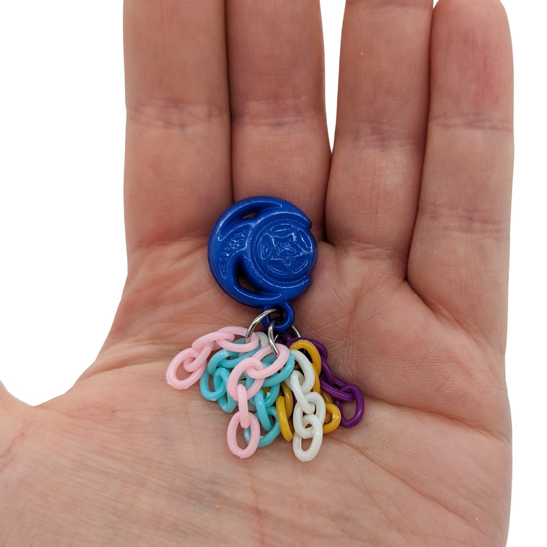 Tassels bird toy, alternate variation, in hand for scale