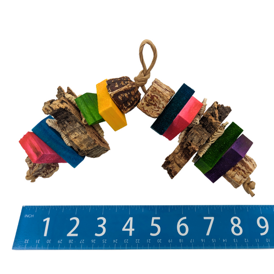 Vim by Lil Monsters Bird Toys. Next to ruler for scale