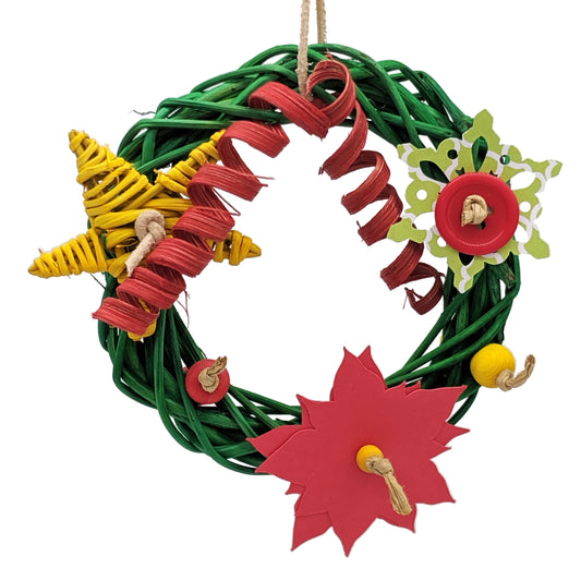 Wreath by Lil Monsters Bird Toys. A Christmas themed parrot toy made with a vine wreath base, adorned with cardstock, vine, cane twists, and wooden beads. 